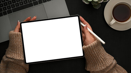 Female graphic designer sketching on digital tablet