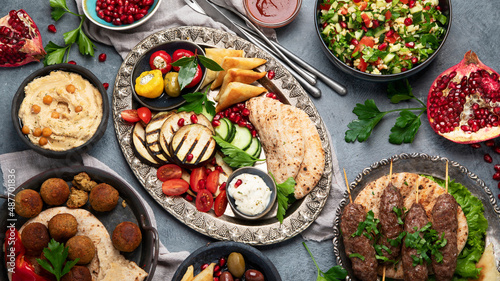 Arabic food assortment on dark background.