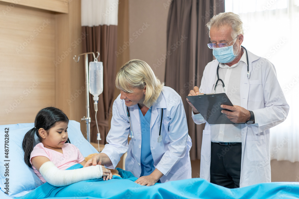 Pediatrician is closely caring and asking about sick girls symptoms, health concepts and child care.