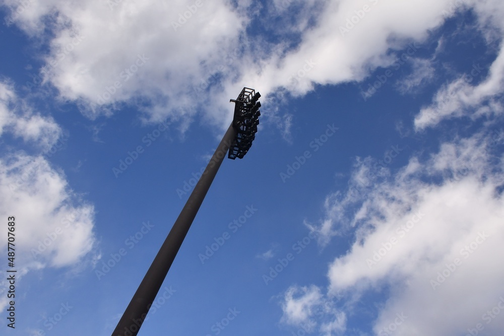 a Pole of light equipment with blue sky a Pole of light equipment with blue sky