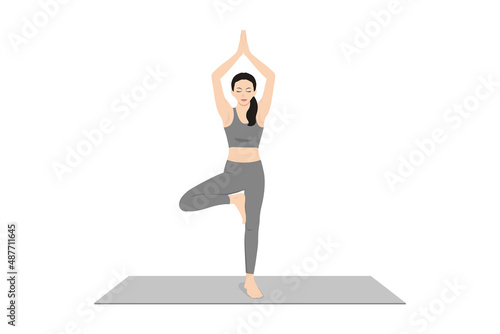 Tree Pose, Vrksasana, Vriksasana,. Beautiful girl practice Vrikshasana. Young attractive woman practicing yoga exercise. working out, black wearing sportswear, grey pants and top, indoor full length