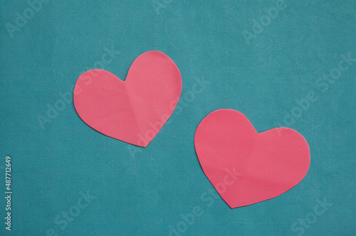 Top view photo with Valentine's Day hearts on an isolated blue background with a copy space
