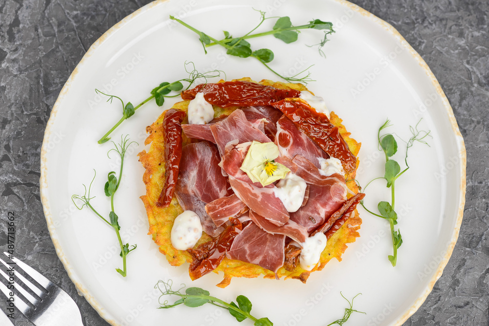dish with potato pancake and hammon and dried pepper
dish with potato pancake and hammon and dried pepper