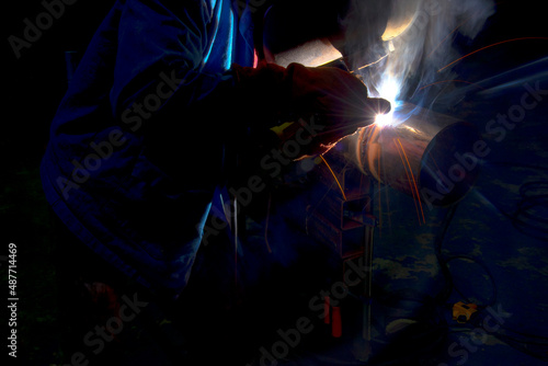 closeup Industrial Worker at the factory welding Pipe welding on the pipeline construction