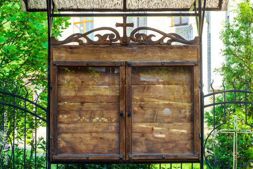 Obraz na plátně Church wooden empty notice board on street