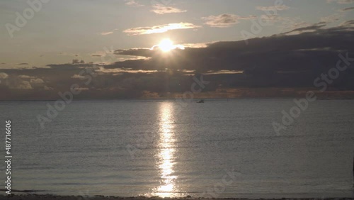 Sunrise and Boat At The Beach