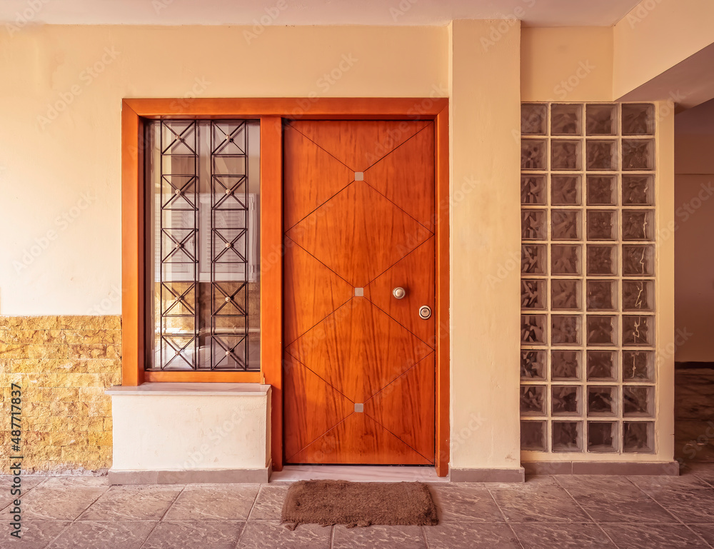 modern residential building entrance with glass blocks and wooden door, Athens Greece modern residential building entrance with glass blocks and wooden door, Athens Greece