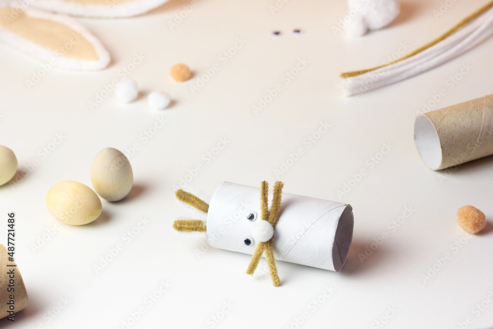 Reuse concept art from toilet tube. Eco friendly bunny craft. Handmade decoration easter rabbit. Kids DIY ideas Reuse concept art from toilet tube. Eco friendly bunny craft. Handmade decoration easter rabbit. Kids DIY ideas