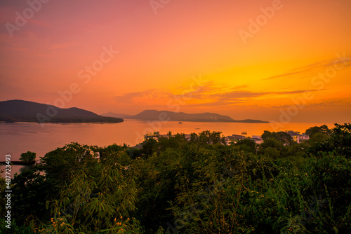 The background of the sea by the evening sea, with natural beauty (sea water, rocks, sky) and fishermen are fishing by the river bank, is a pleasure during travel.