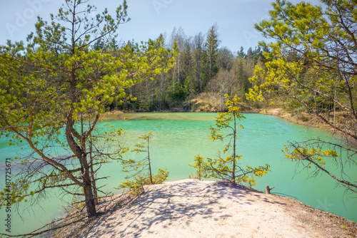 A beautiful spring scenery at the small lake with turquoise blue water. Northern Europe.