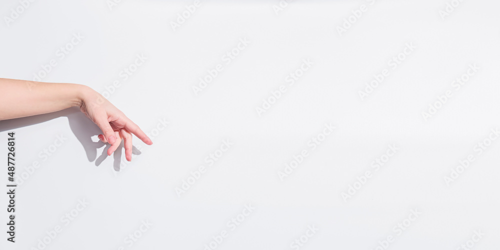Adult woman hand to hold something flat, isolated on white. Copy space banner for advert advertisement Adult woman hand to hold something flat, isolated on white. Copy space banner for advert advertisement