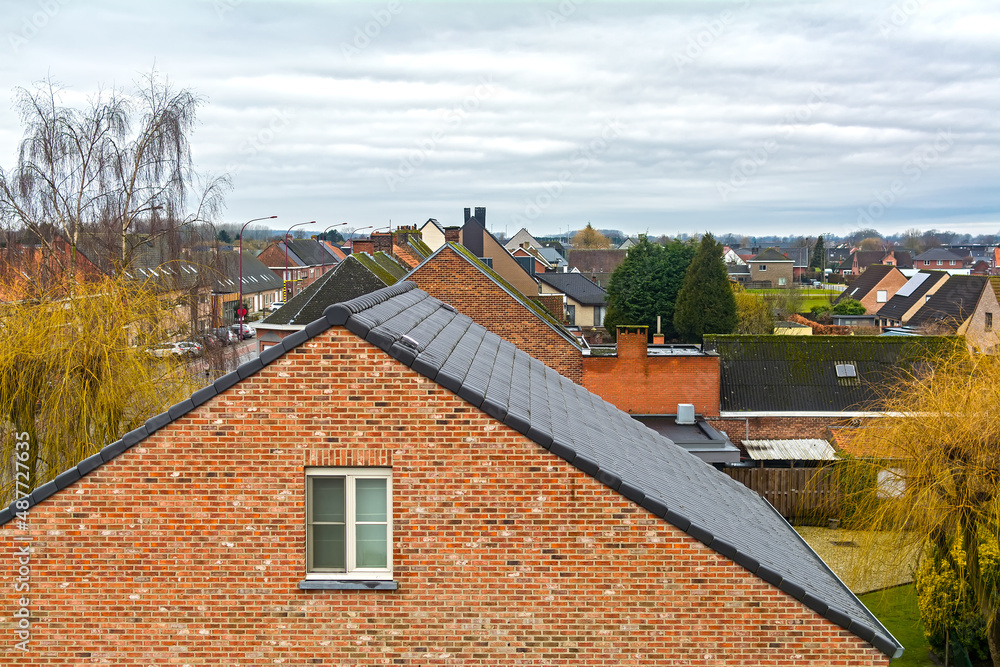 Gabled roof old brick house in Gavere town, located in the Belgian province of east flanders, Belgium Gabled roof old brick house in Gavere town, located in the Belgian province of east flanders, Belgium