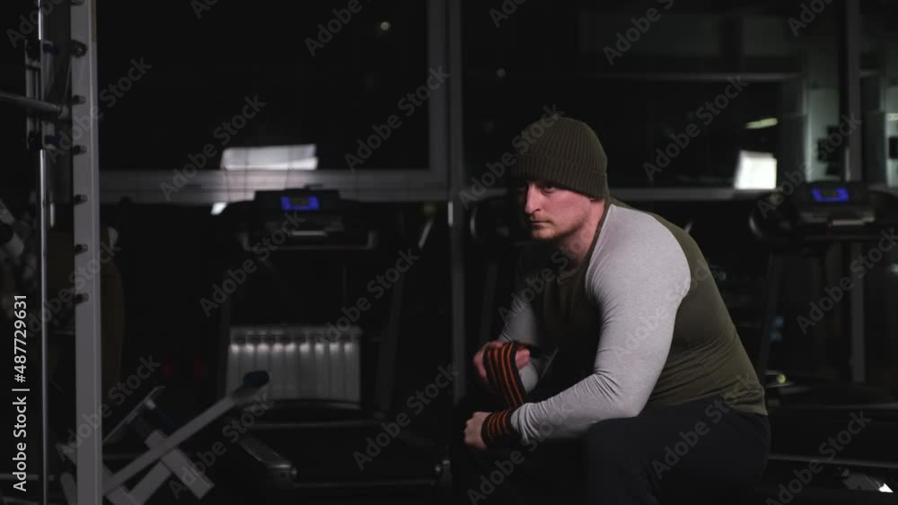 Man with strong arms getting ready for a workout Man with strong arms getting ready for a workout