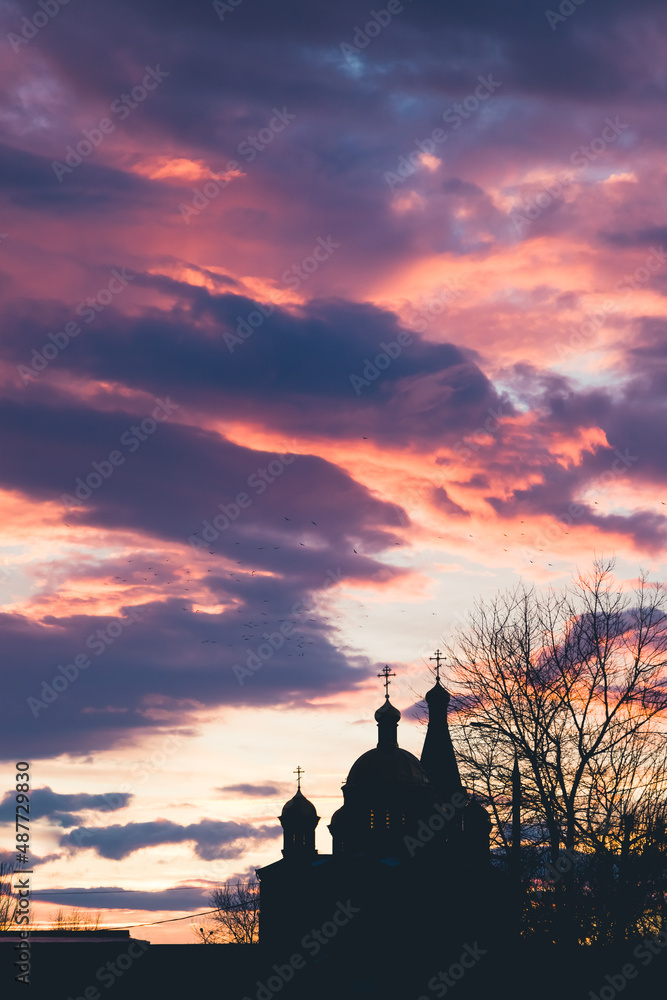 sunset sky and silhouette of the church