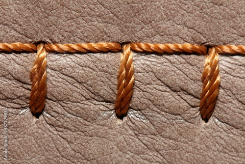 nylon thread stitches natural leather with a decorative seam
