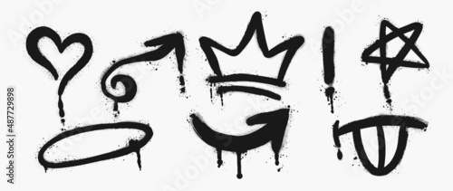 Set of black graffiti spray pattern. Collection of symbols, heart, crown, arrows and star with spray texture. Elements on white background for banner, decoration, street art and ads. photo