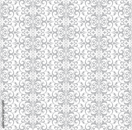 Wallpaper in the style of Baroque. Seamless vector background. White and gray floral ornament. Graphic pattern for fabric, wallpaper, packaging. Ornate Damask flower ornament.