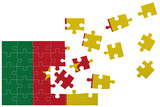 Broken puzzle- game background in colors of national flag. Cameroon