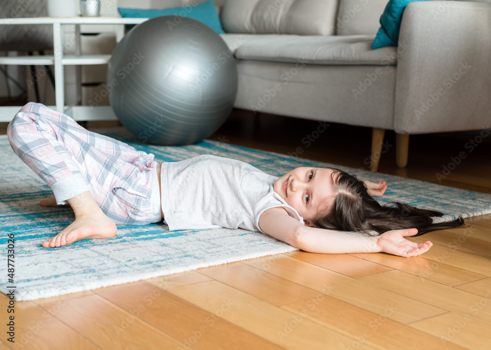 Girl doing stretching at home. Workout at home. Girl doing stretching at home. Workout at home.