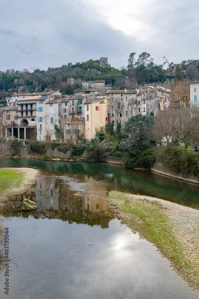 Sauve, medieval village in France, view of typical houses, reflection on the river
