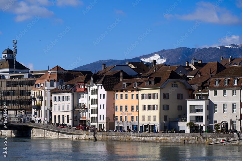 View at the old town of Solothurn seen form the Kreuzacker Bridge on a sunny winter day with river Aare in the foreground. Photo taken February 7th, 2022, Solothurn, Switzerland.