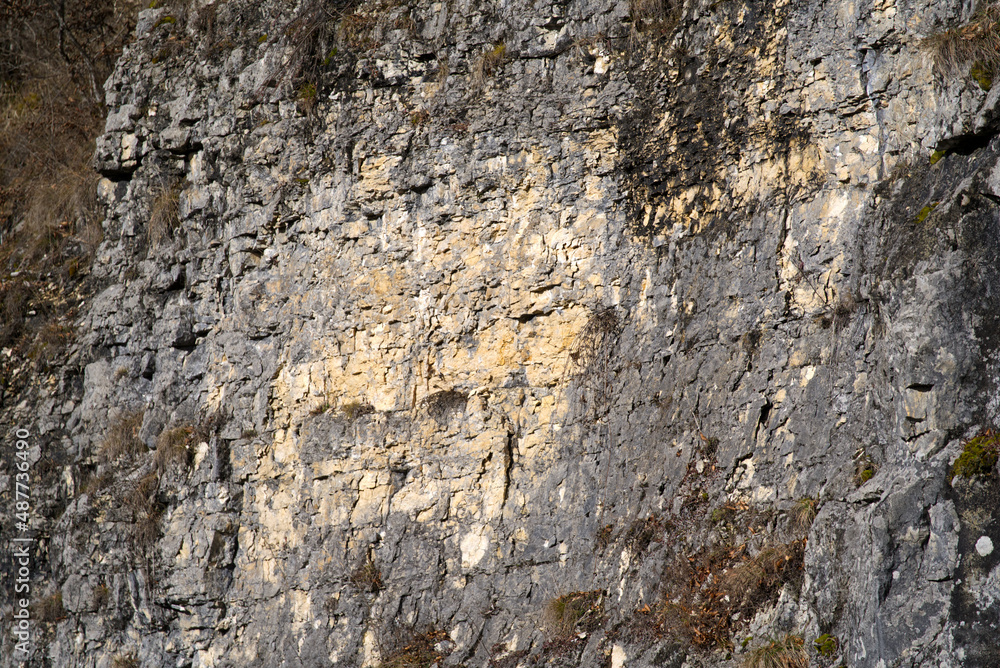 Close-up of chalk rock on a sunny winter day near the little medieval town St-Ursanne. Photo taken February 7th, 2022, Saint-Ursanne, Switzerland. Close-up of chalk rock on a sunny winter day near the little medieval town St-Ursanne. Photo taken February 7th, 2022, Saint-Ursanne, Switzerland.