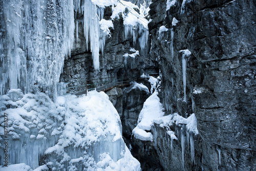 Breitachklamm Alps - snow and dramatic frozen ice covered paths within a gorge and mountains 