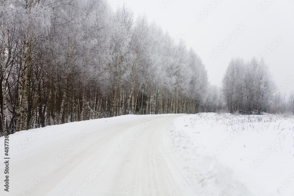 Russian rural road covered with white snow.