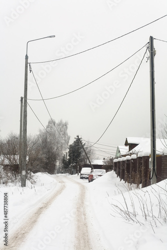 Power poles in the countryside on a winter day.