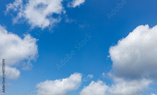 Blue sky with fluffy clouds 