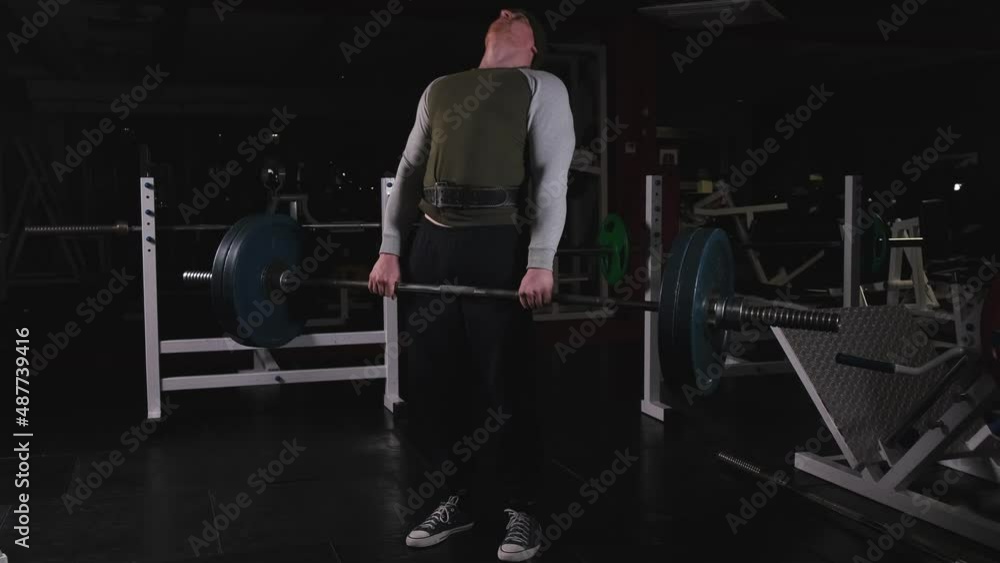 Deadlift with a heavy barbell in the male performance Deadlift with a heavy barbell in the male performance