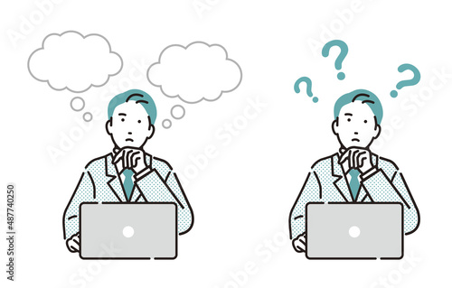 パソコンをしながら考えるビジネスパーソン男性