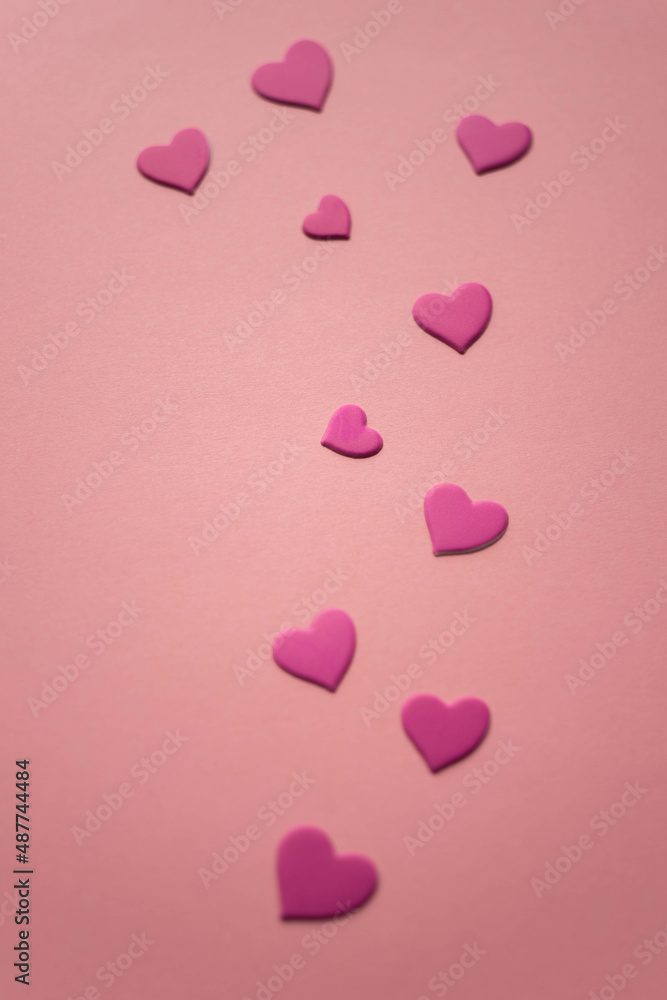 Lovely magenta pink hearts on pink paper table