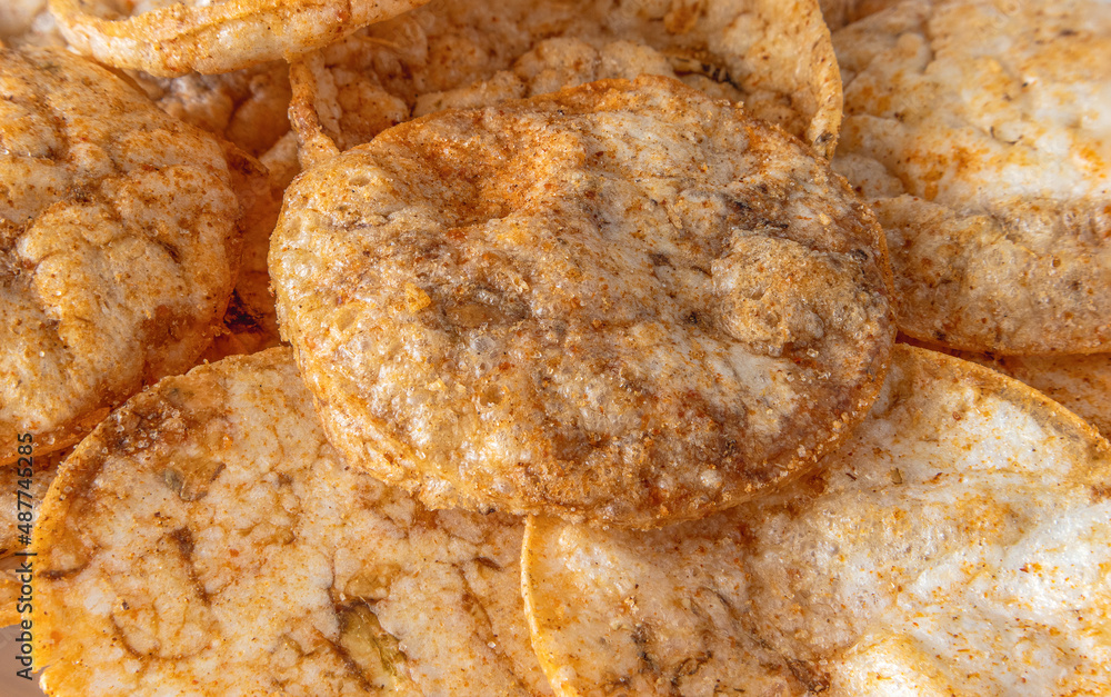 Brown rice chips texture background close up Brown rice chips texture background close up