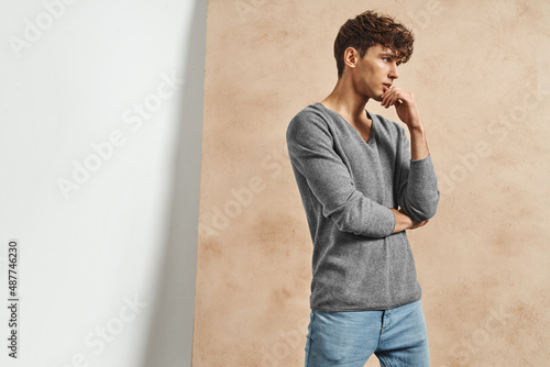 Portrait of young man over old grungy wall