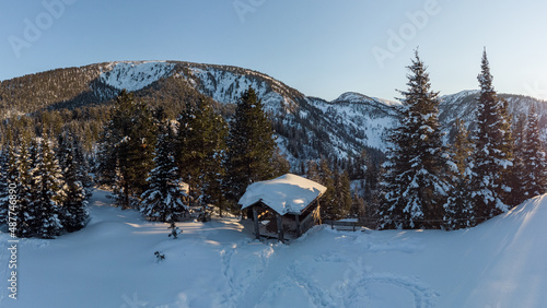 Aerial view of a gazebo in a snowy winter forest