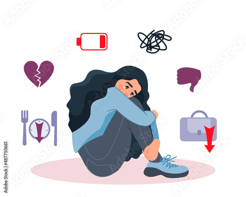 An unhappy depressed girl is sitting on the floor. The girl suffers from failures in her personal life, emotional burnout, problems at work, fatigue and a downed regime. The concept of mental health