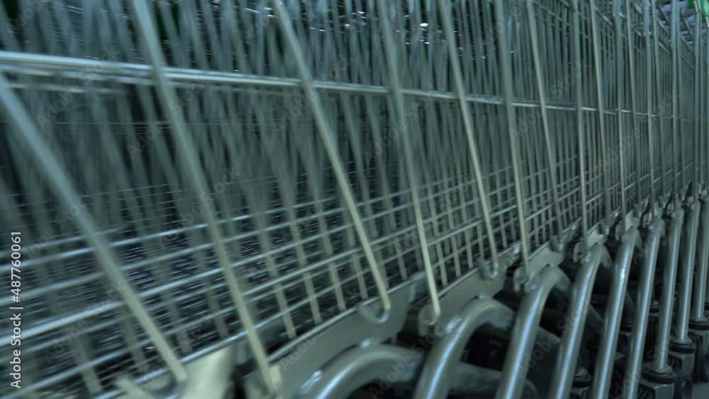 A row of carts in a shopping center. Nobody. Dolly A row of carts in a shopping center. Nobody. Dolly