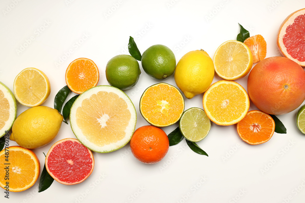 Citrus fruits with leaves on white background Citrus fruits with leaves on white background
