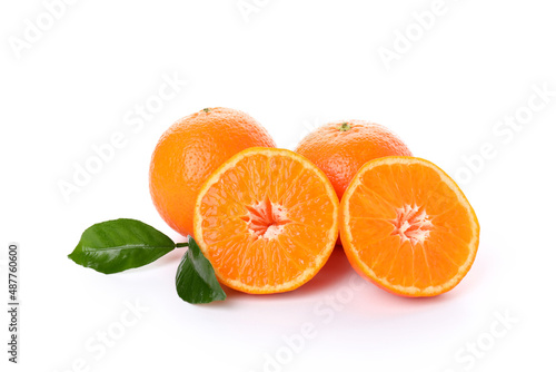 Oranges with leaves isolated on white background