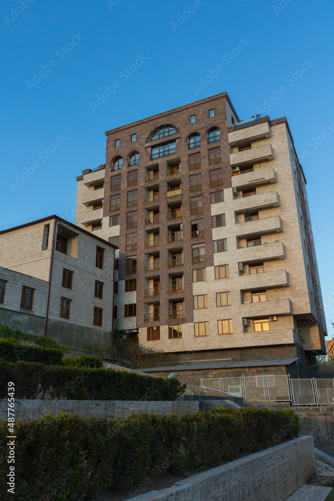 Beautiful apartment building lined with traditional stone in Yerevan. Armenia 