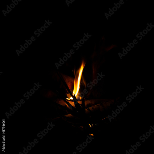 taiga bonfire on a black background in the forest.noisy and blurry photography