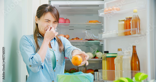 woman is pouring food waste photo