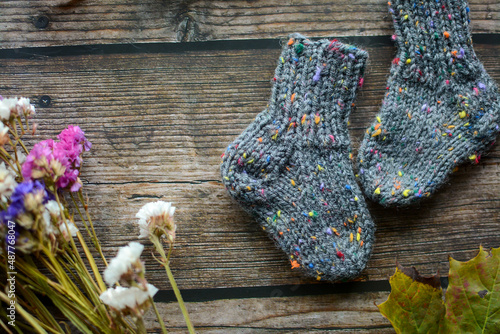 Fototapeta Naklejka Na Ścianę i Meble -  Chunky gray newborn socks, made of soft cotton yarn