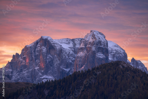 Beautiful colors during sunrise overlooking the beautiful mountains of the Brenta group in the Trentino region in the Dolomites. The sky turned completely red and purple.