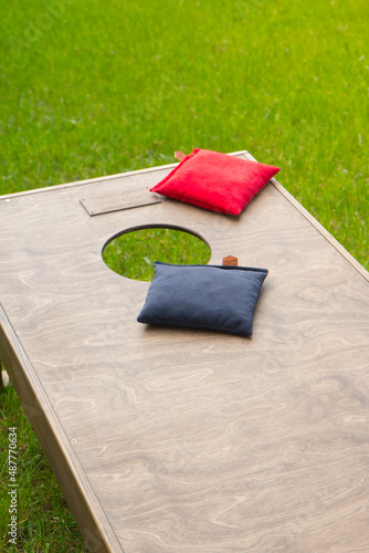 Cornhole bags on a board close up
