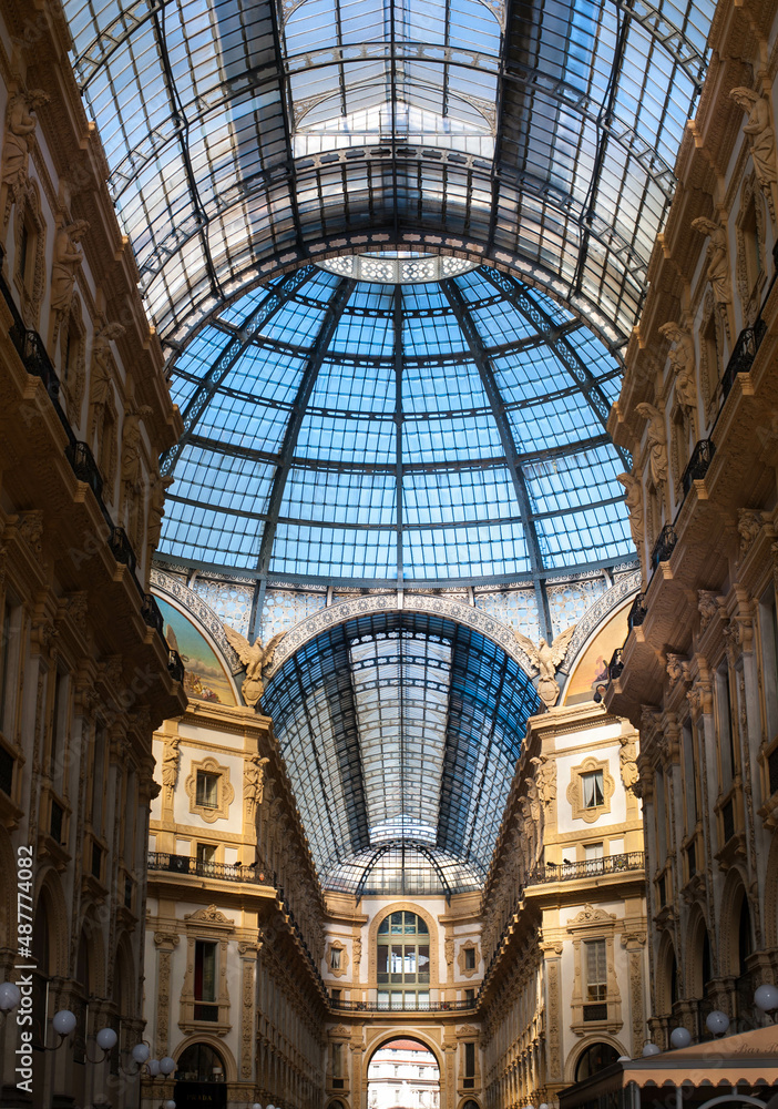 interior famous luxurious italian shopping gallery with glass arch roof on duomo square