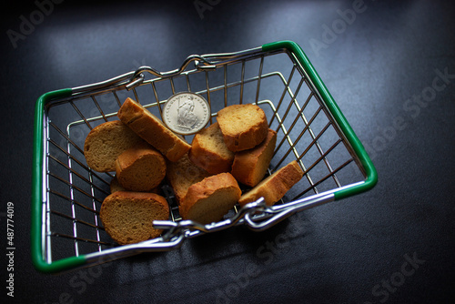 Small empty supermarket grocery shopping basket toy isolated on blue pastel colorful trendy background. Copy space. Sale buy mall market shop online shopping consumer concept
