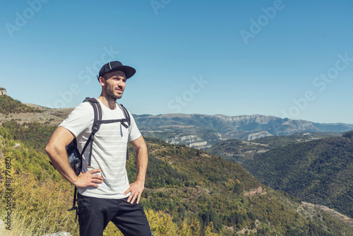 Young man hiking in the summer mountain .Bov Village, Balkan Mountain, Iskar Gorge