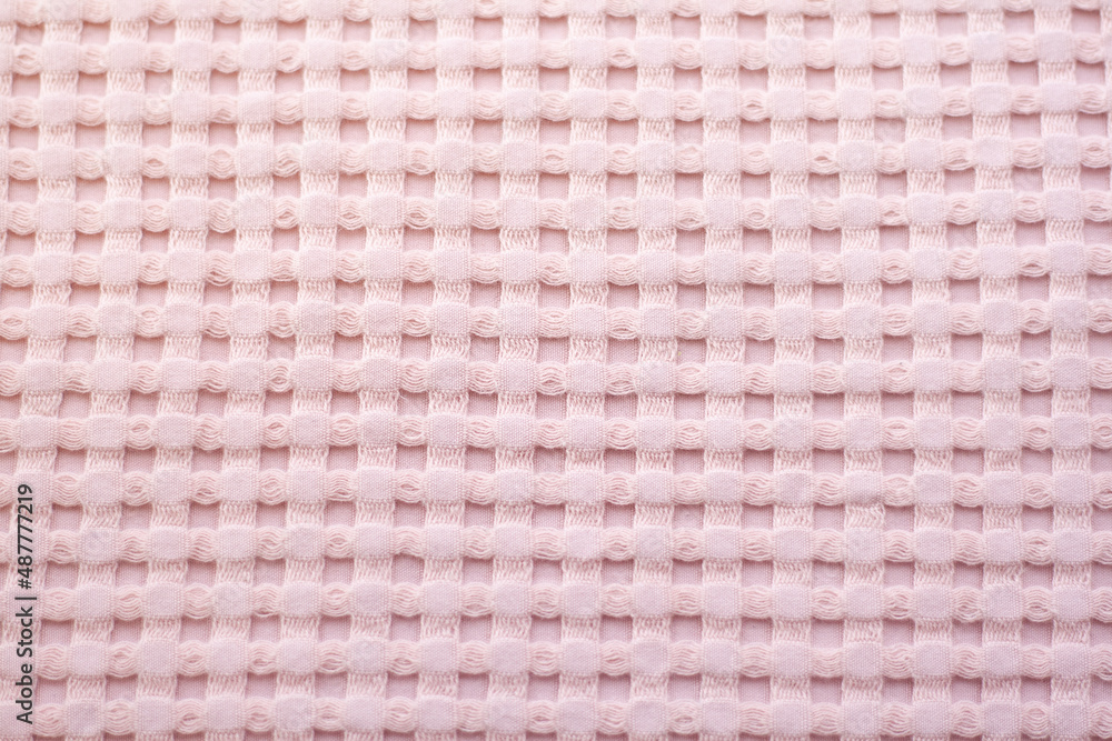 Pink hearts on a pink background. The textile background is pink. Pink hearts on a pink background. The textile background is pink.